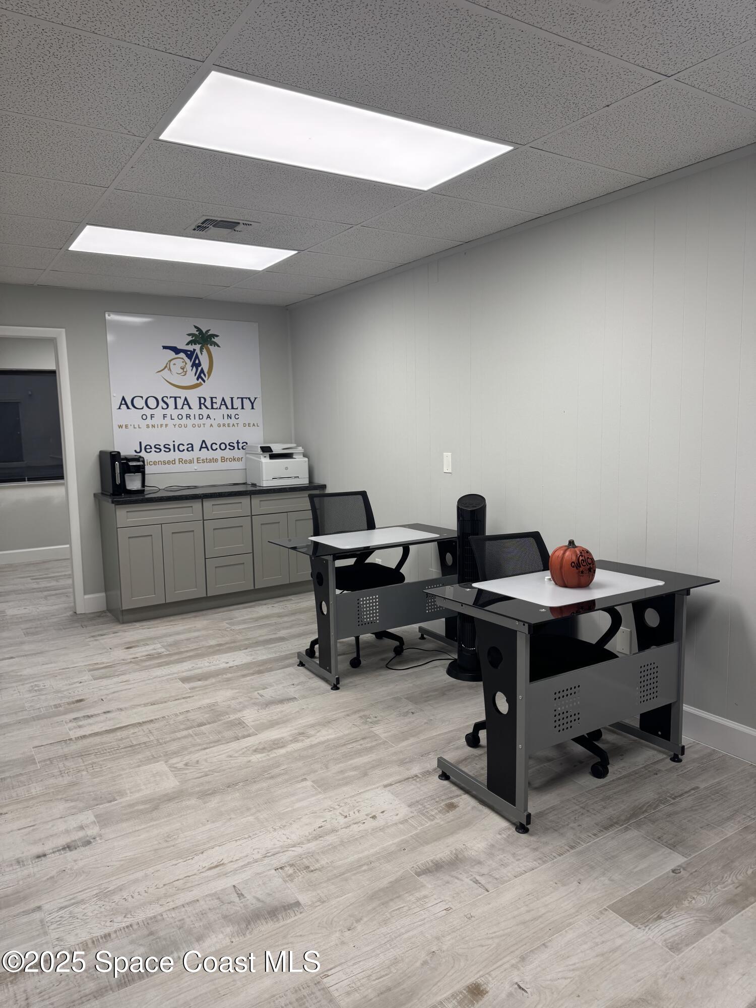 700 North Wickham Road, Unit 101 Melbourne, FL 32935 - Photo 3 of 12 a workspace with furniture