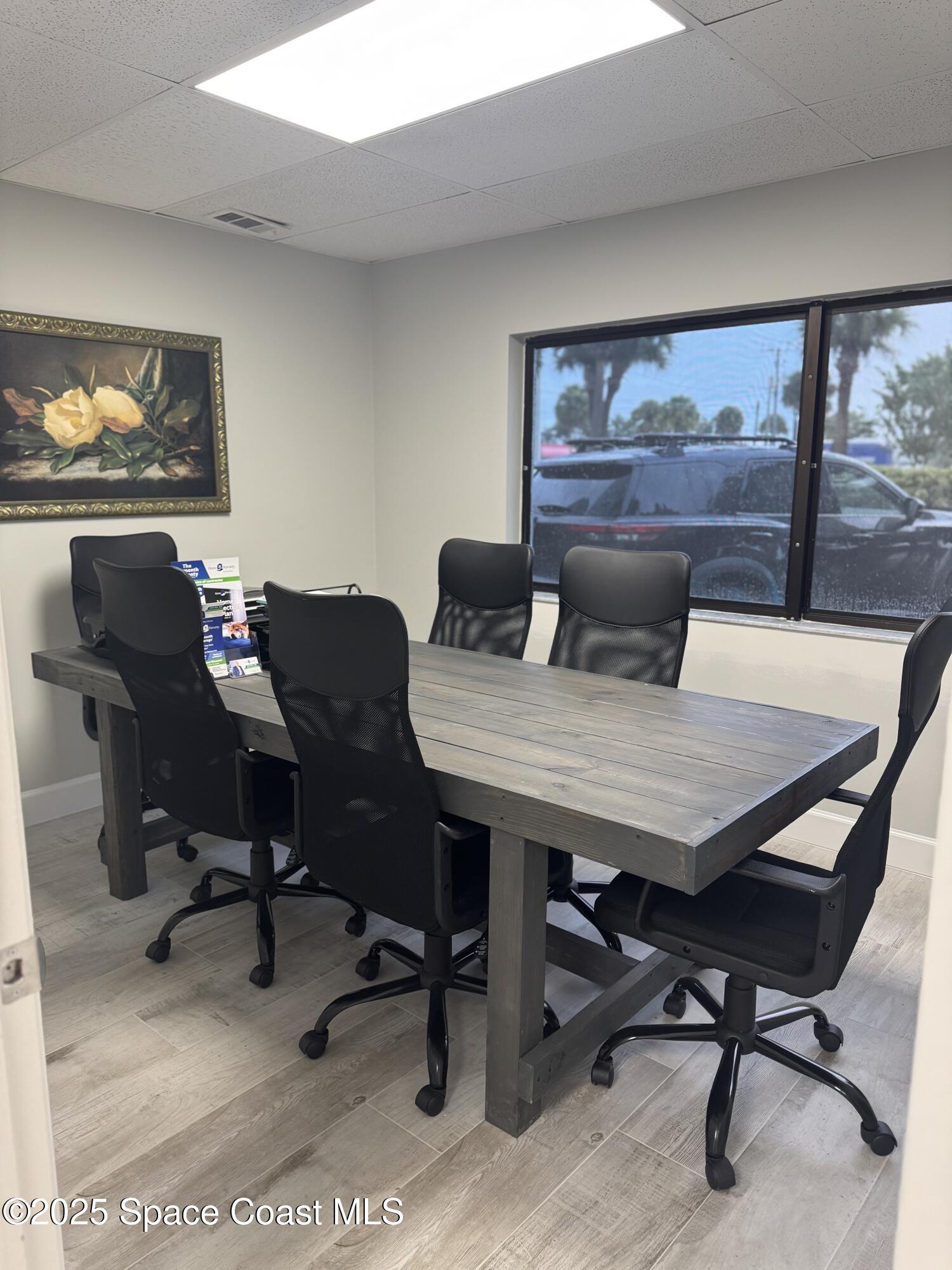 700 North Wickham Road, Unit 101 Melbourne, FL 32935 - Photo 8 of 12 a view of a dining room with furniture