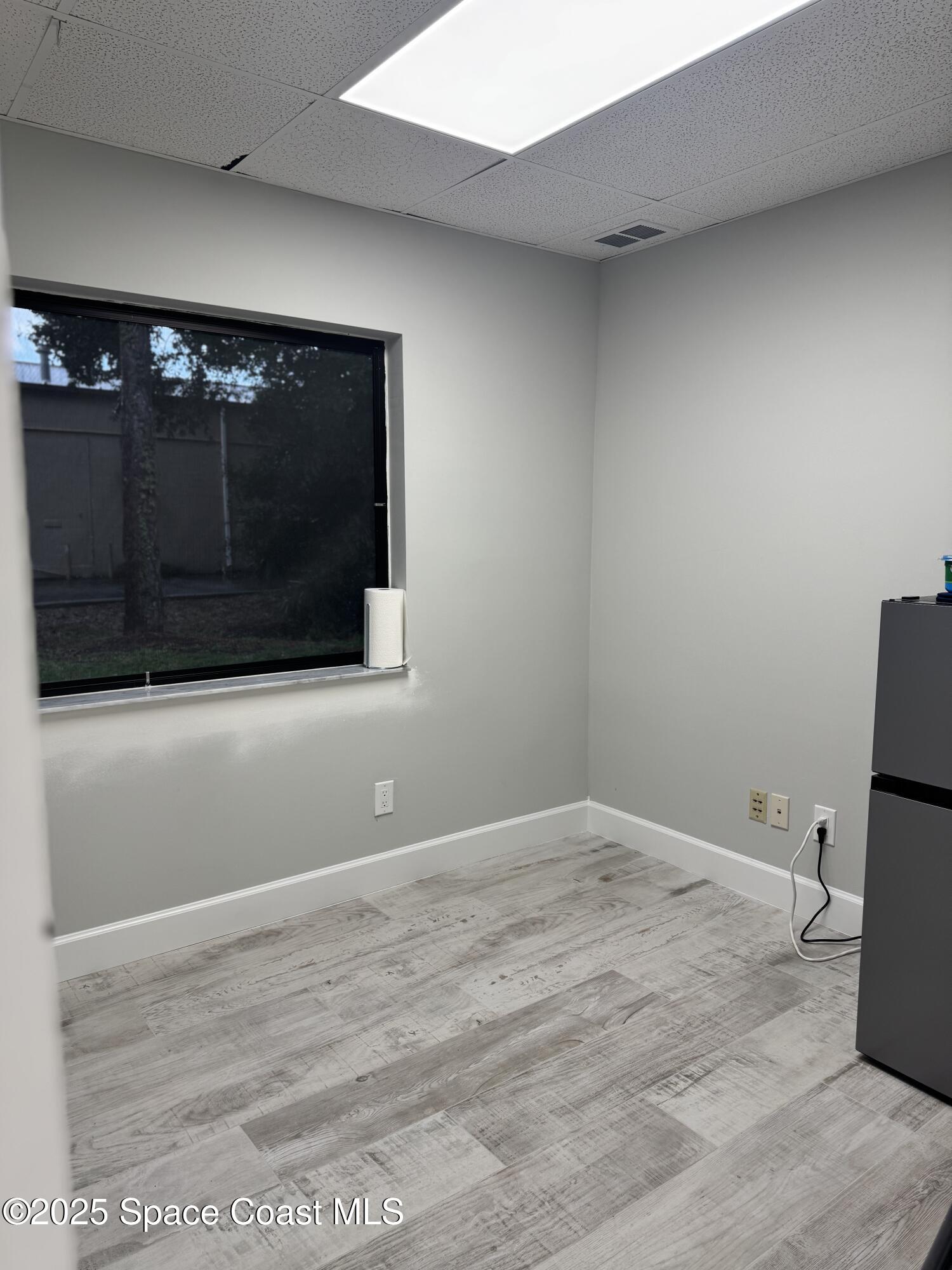 700 North Wickham Road, Unit 101 Melbourne, FL 32935 - Photo 9 of 12 a view of wooden floor