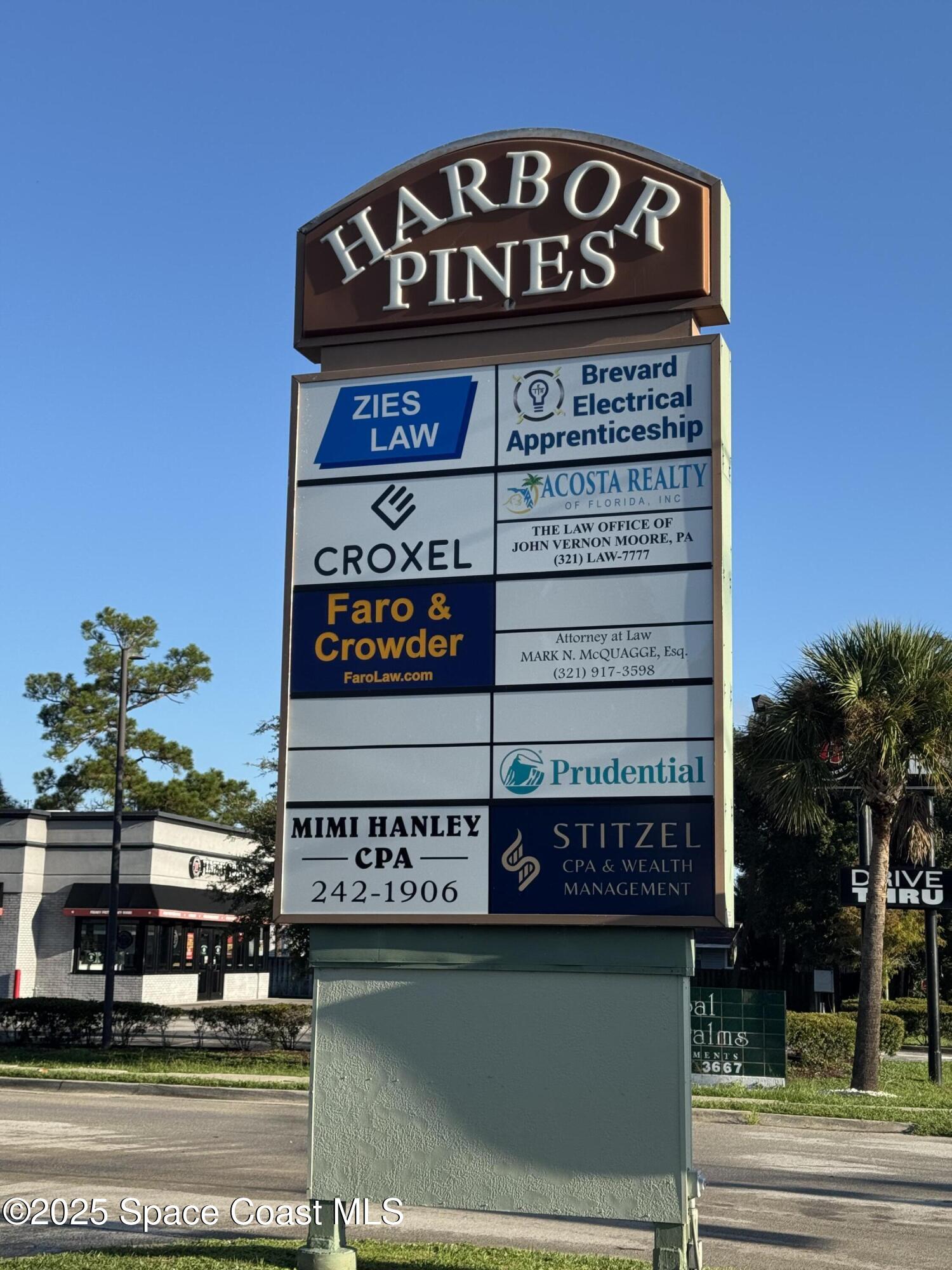 700 North Wickham Road, Unit 101 Melbourne, FL 32935 - Photo 10 of 12 a sign on the side of a building