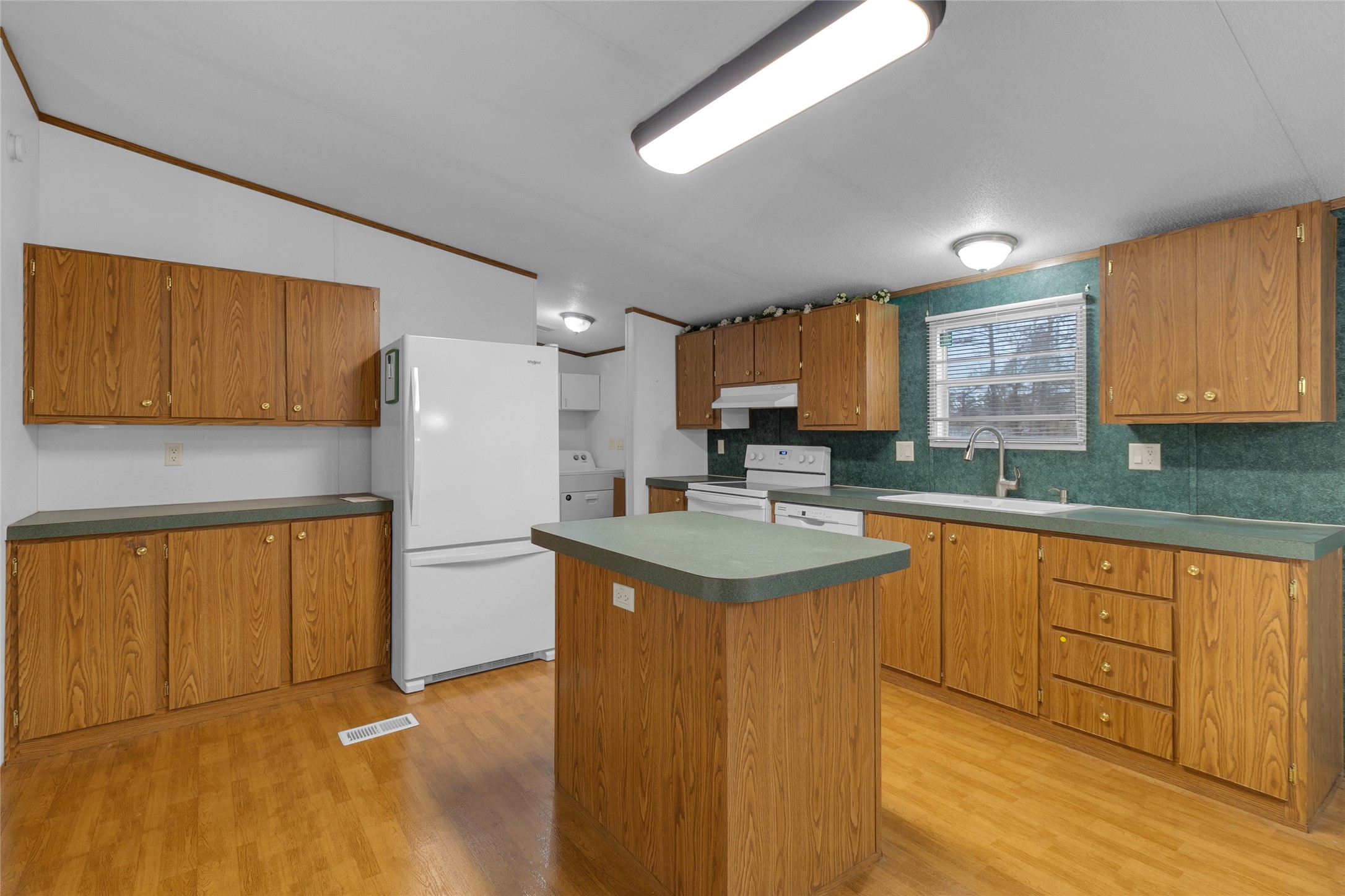 22094 Spear Road Porter, TX 77365 - Photo 11 of 45 a kitchen with stainless steel appliances granite countertop a sink stove and refrigerator