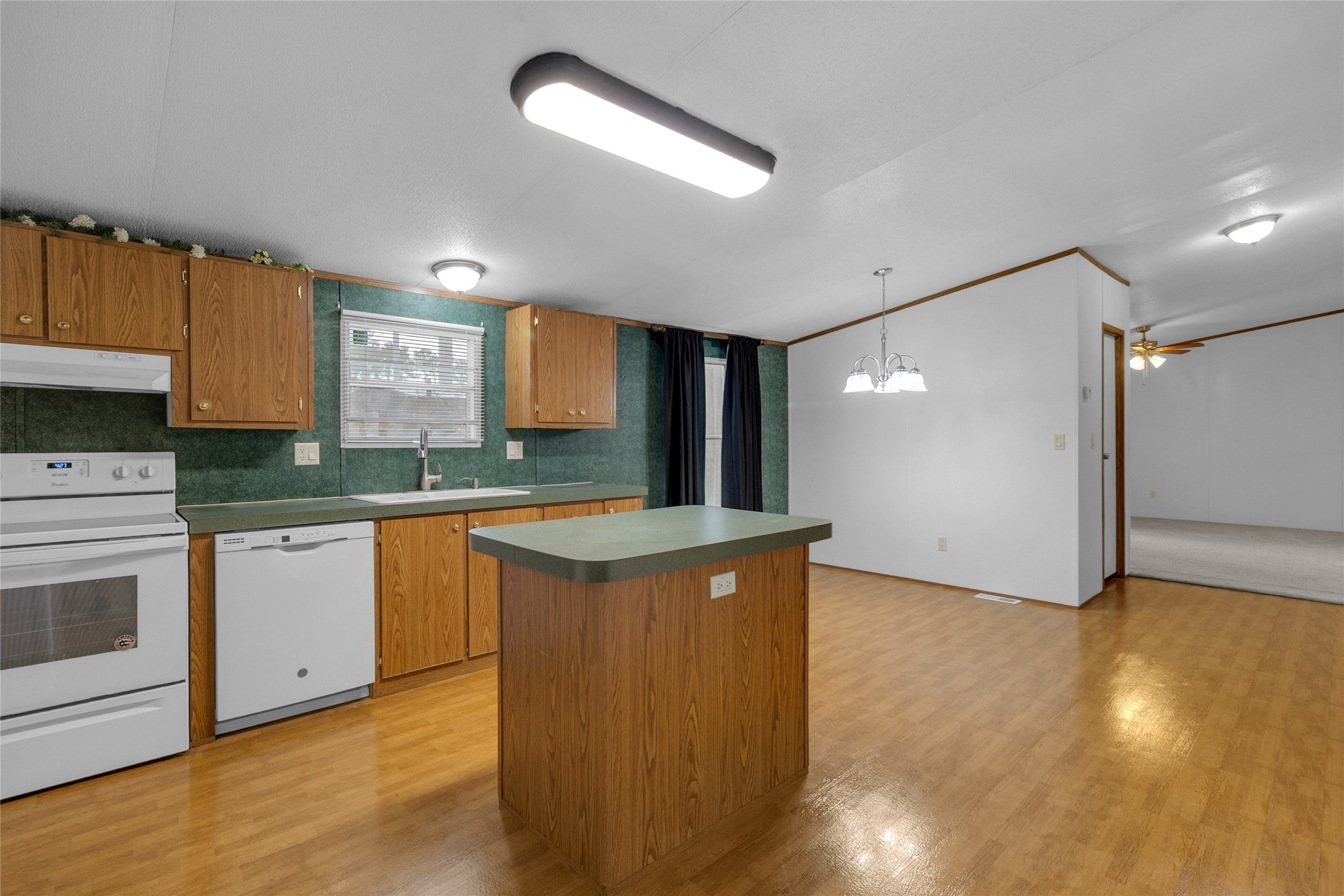 22094 Spear Road Porter, TX 77365 - Photo 12 of 45 a kitchen with stainless steel appliances granite countertop a stove and a sink