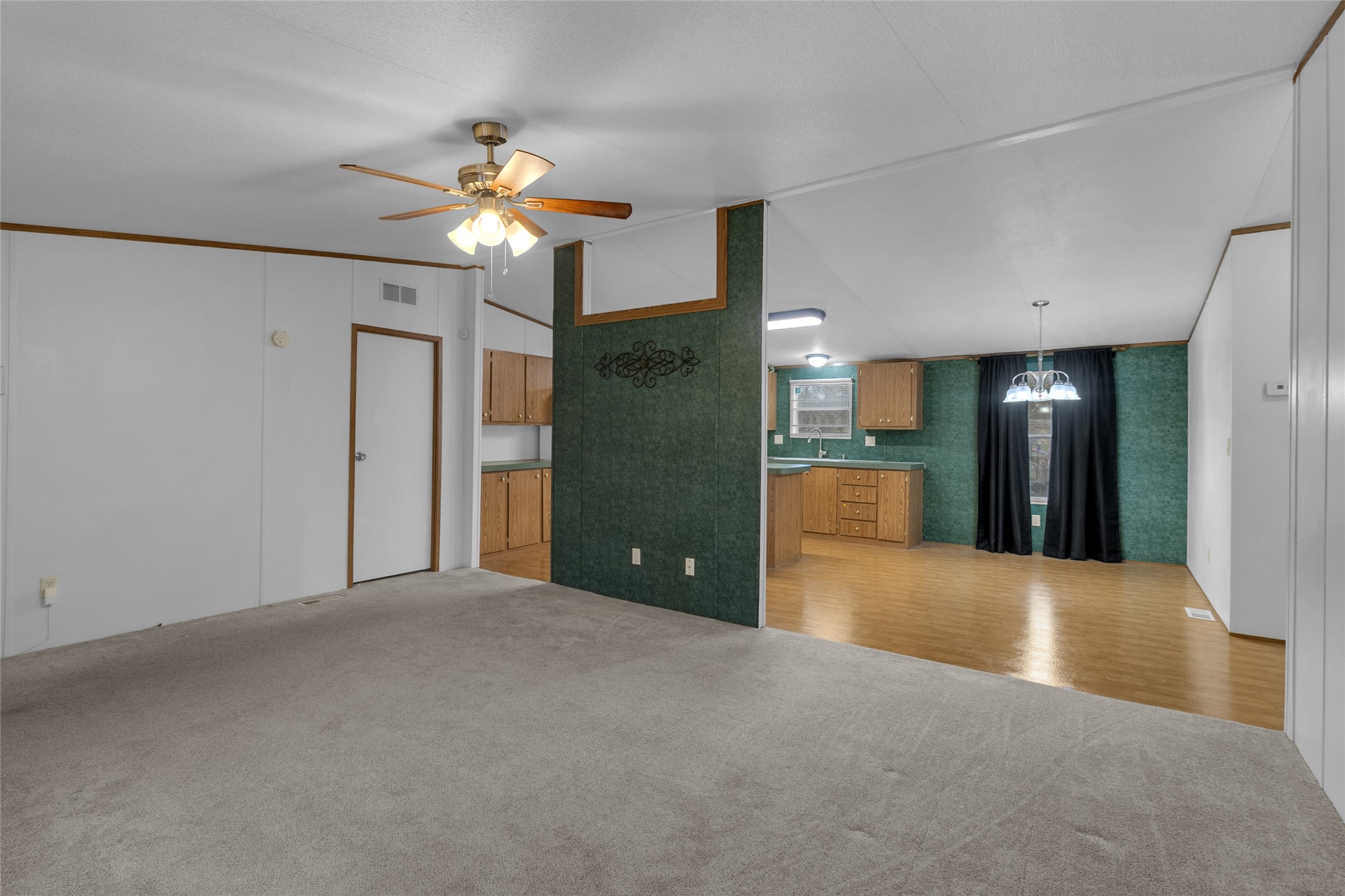 22094 Spear Road Porter, TX 77365 - Photo 17 of 45 a view of a hallway with a chandelier fan and windows
