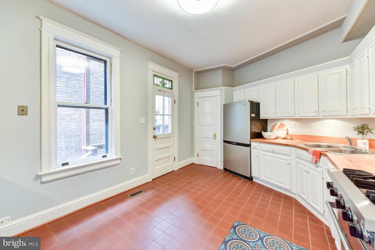 110 13th Street Southeast Washington, DC 20003 - Photo 16 of 58 Table-space kitchen, looking to side patio