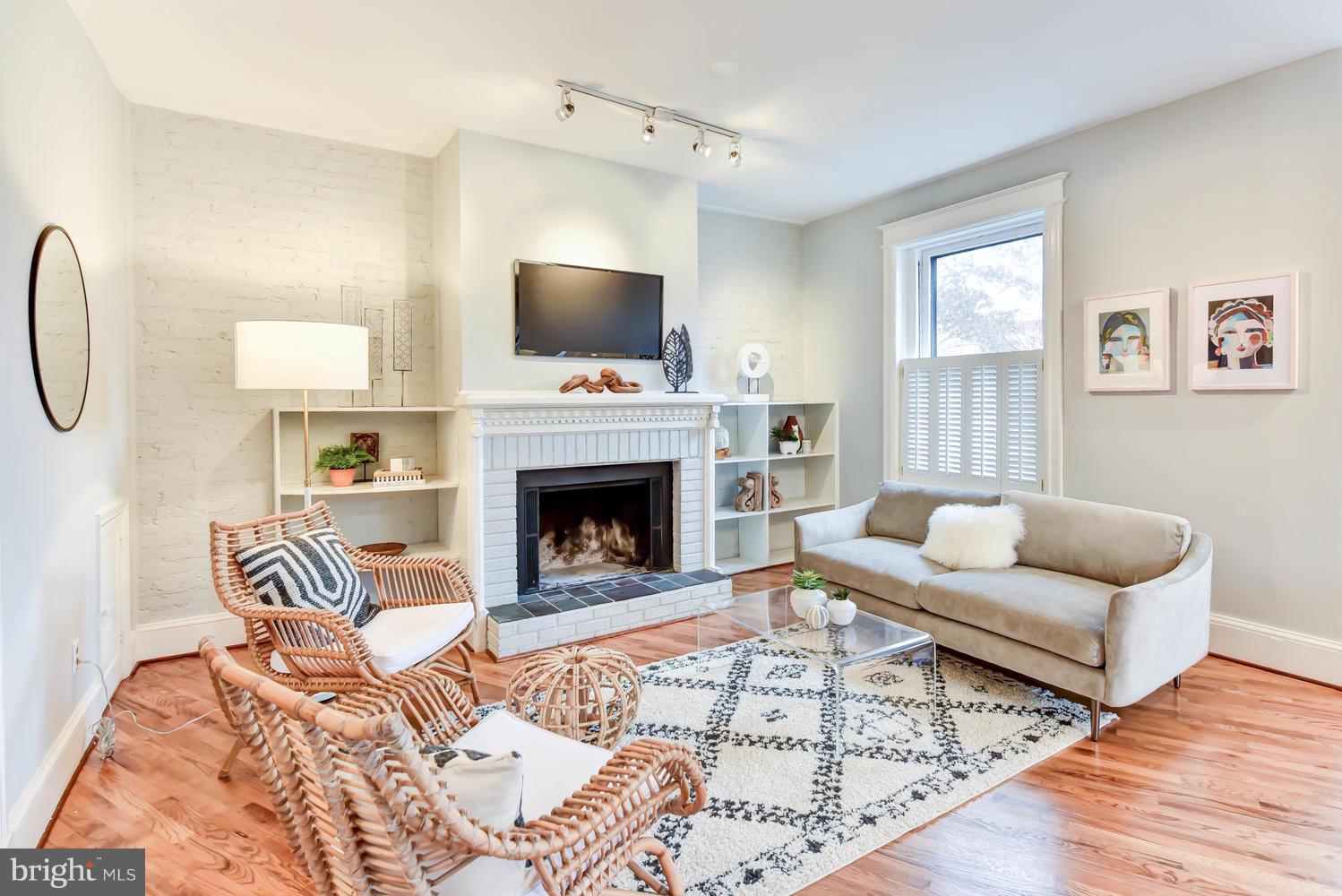110 13th Street Southeast Washington, DC 20003 - Photo 4 of 58 Fireplace at rear of double living room