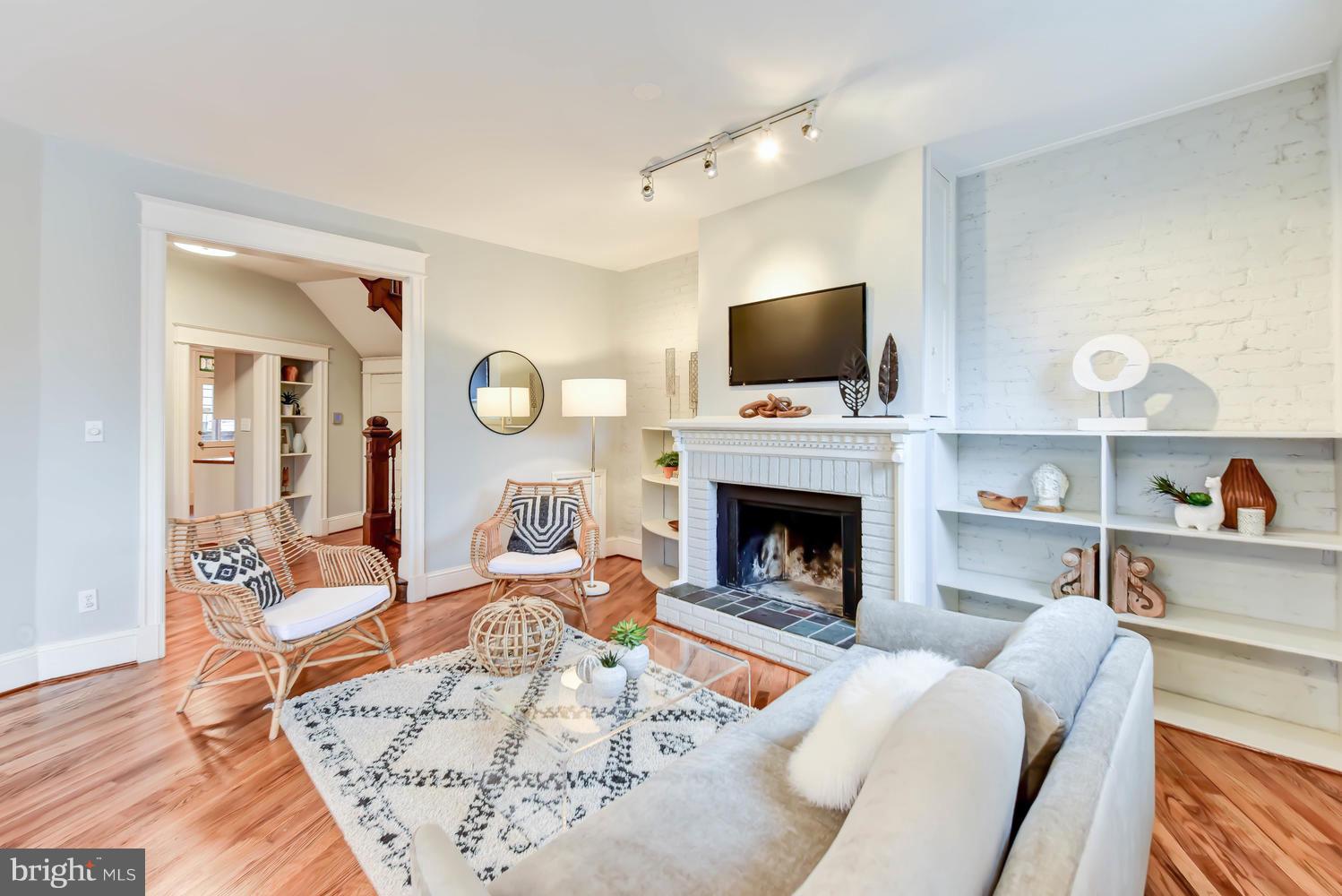 110 13th Street Southeast Washington, DC 20003 - Photo 5 of 58 Back half of double living room, stair hall beyond