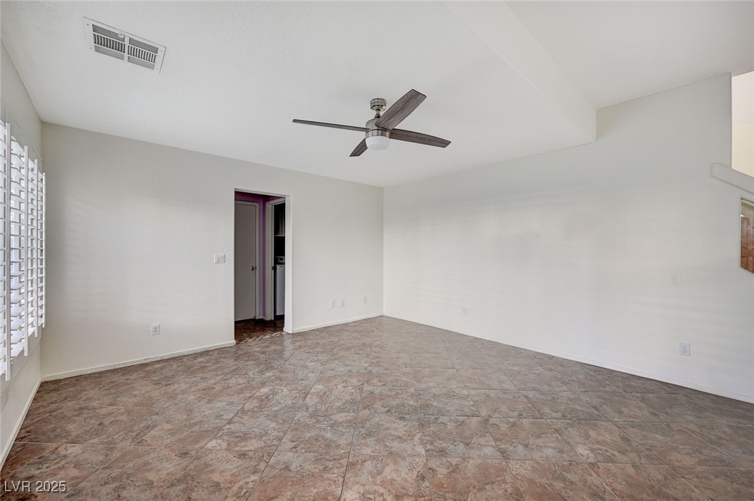 8776 Country View Avenue Las Vegas, NV 89129 - Photo 14 of 43 Unfurnished room featuring a ceiling fan and baseboards