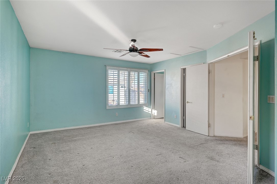 8776 Country View Avenue Las Vegas, NV 89129 - Photo 20 of 43 Unfurnished bedroom featuring carpet and ceiling fan