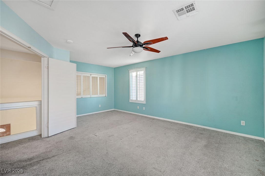 8776 Country View Avenue Las Vegas, NV 89129 - Photo 22 of 43 Unfurnished bedroom featuring carpet and ceiling fan