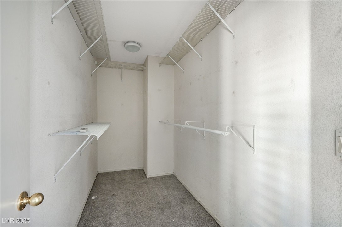 8776 Country View Avenue Las Vegas, NV 89129 - Photo 26 of 43 Spacious closet featuring light colored carpet