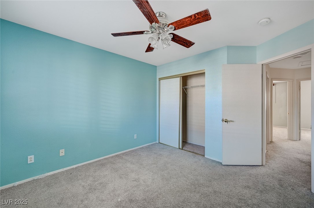 8776 Country View Avenue Las Vegas, NV 89129 - Photo 30 of 43 Unfurnished bedroom with carpet flooring, a closet, and ceiling fan