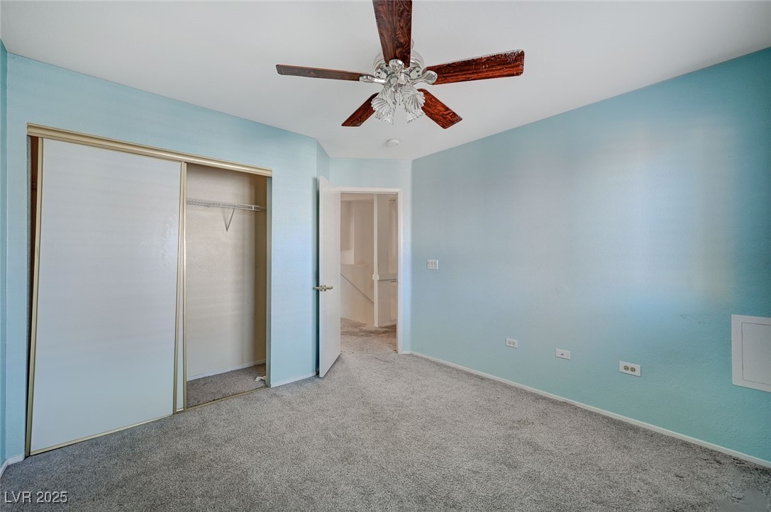 8776 Country View Avenue Las Vegas, NV 89129 - Photo 31 of 43 Unfurnished bedroom with carpet flooring, a ceiling fan, and a closet