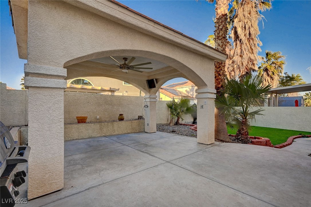 8776 Country View Avenue Las Vegas, NV 89129 - Photo 39 of 43 Fenced backyard featuring ceiling fan and a patio