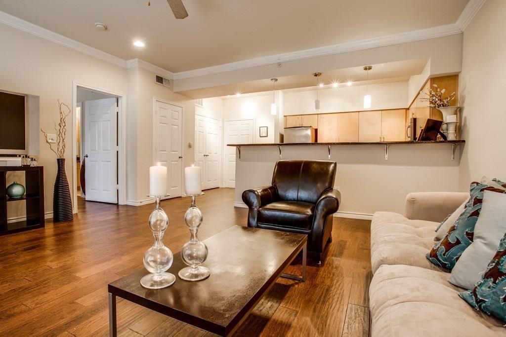 3102 Kings Road, Unit 3310 Dallas, TX 75219 - Photo 10 of 19 a living room with furniture and wooden floor