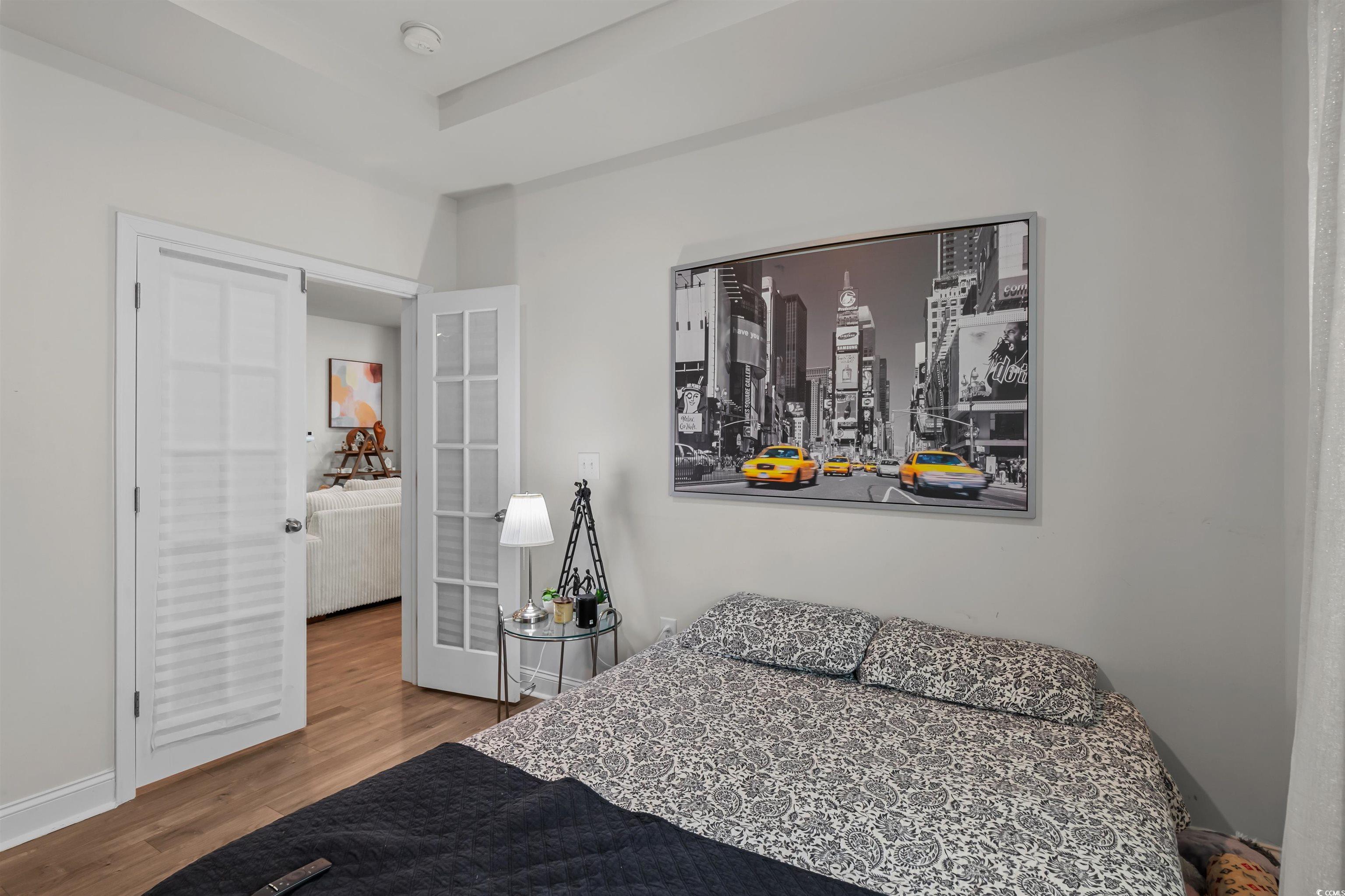 1176 HARBISON Circle Myrtle Beach, SC 29579 - Photo 13 of 40 Bedroom with baseboards, wood finished floors, and french doors
