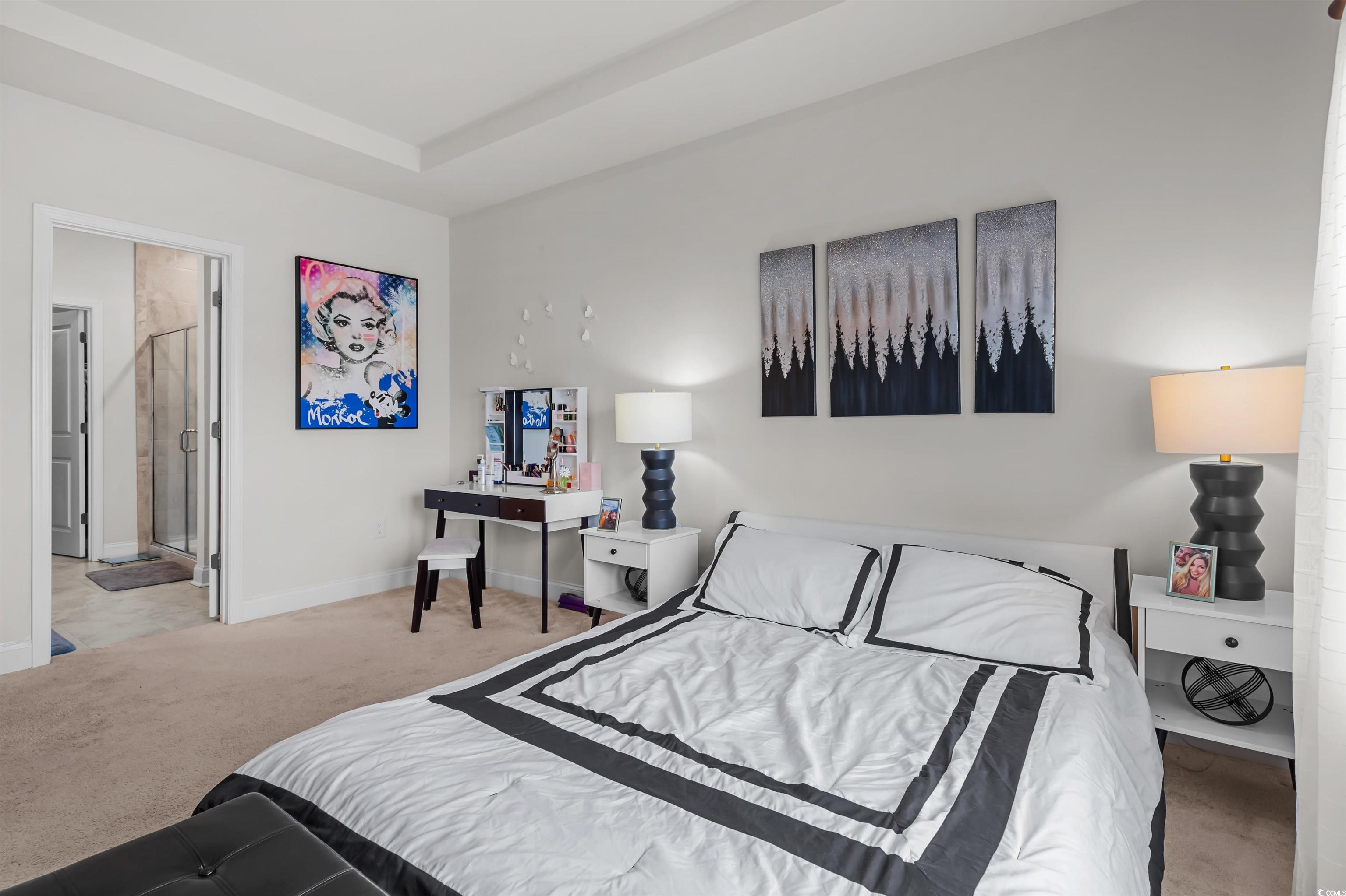 1176 HARBISON Circle Myrtle Beach, SC 29579 - Photo 22 of 40 Bedroom featuring baseboards, carpet, and a raised ceiling