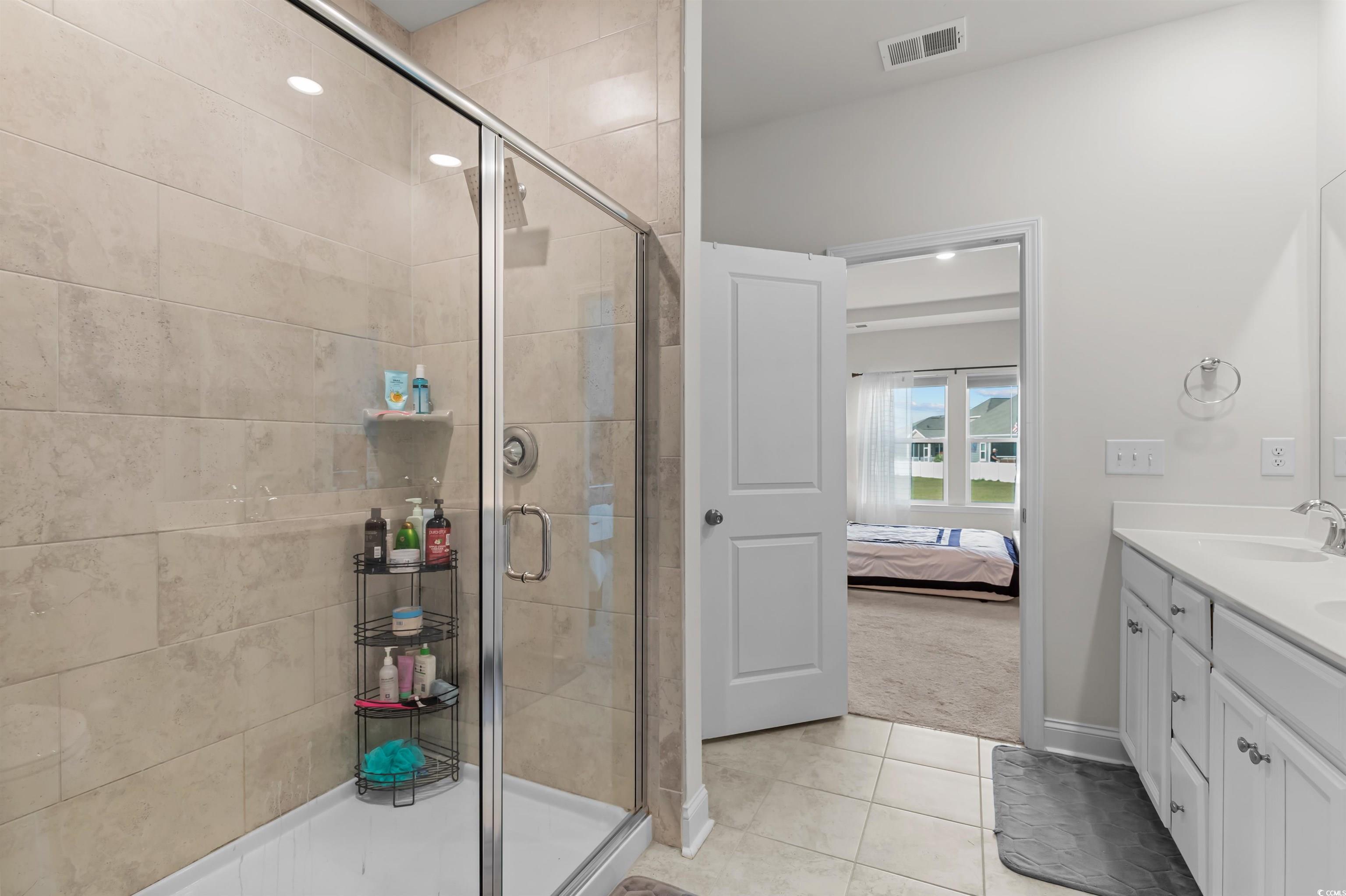 1176 HARBISON Circle Myrtle Beach, SC 29579 - Photo 26 of 40 Ensuite bathroom featuring ensuite bathroom, visible vents, and a shower stall