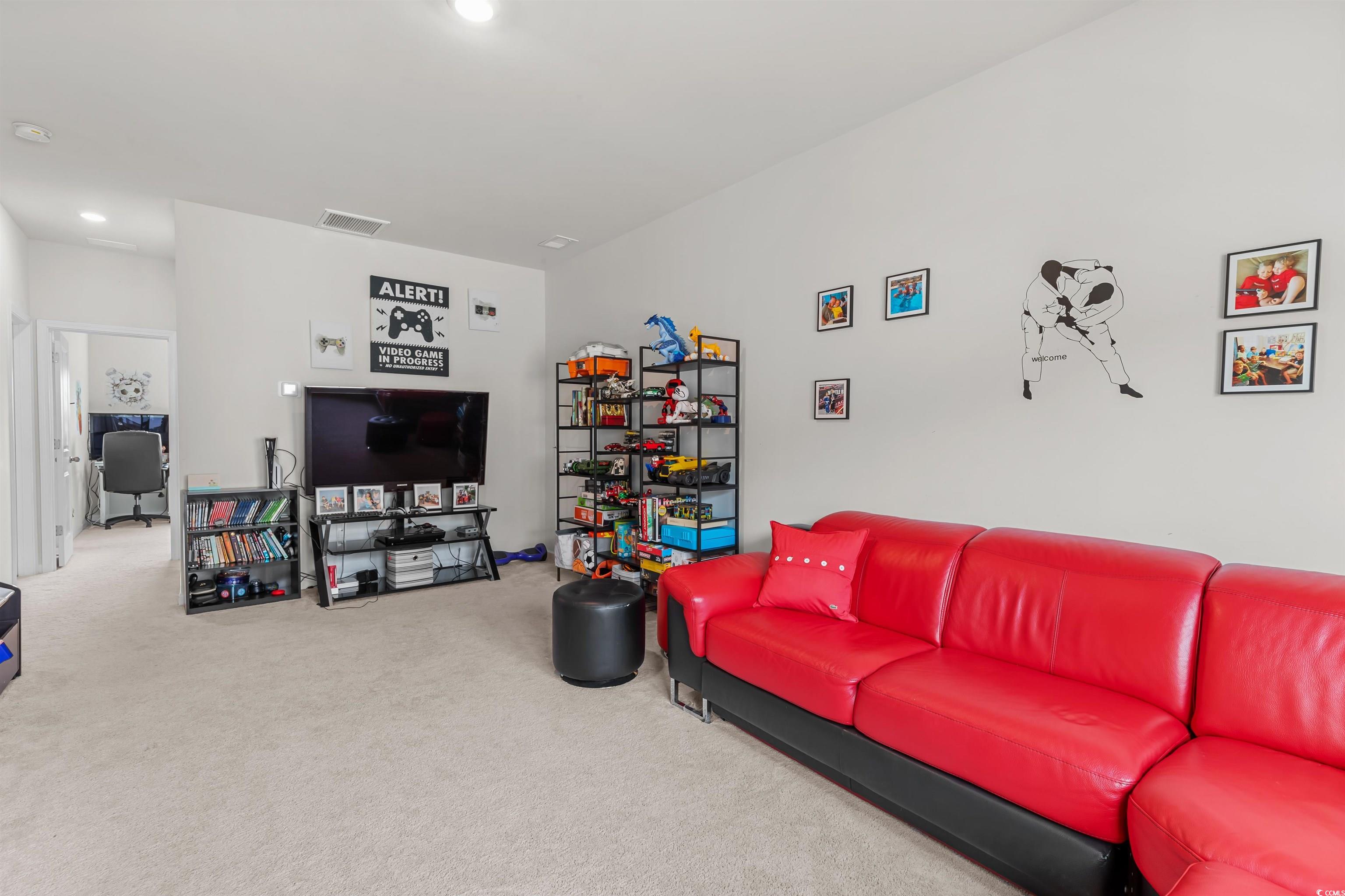1176 HARBISON Circle Myrtle Beach, SC 29579 - Photo 29 of 40 Carpeted living room with recessed lighting and visible vents