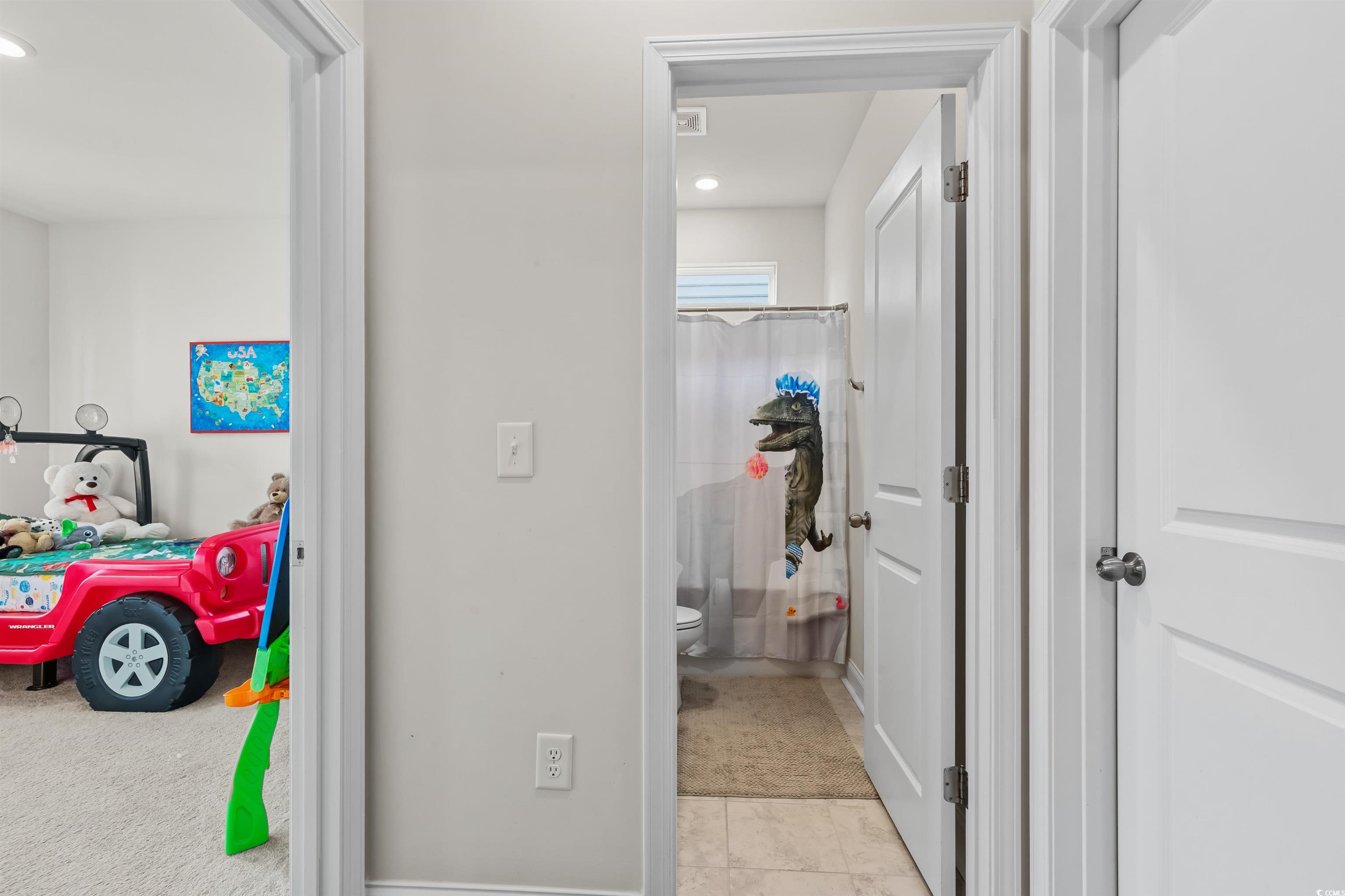 1176 HARBISON Circle Myrtle Beach, SC 29579 - Photo 3 of 40 Hallway featuring carpet flooring, tile patterned flooring, and recessed lighting