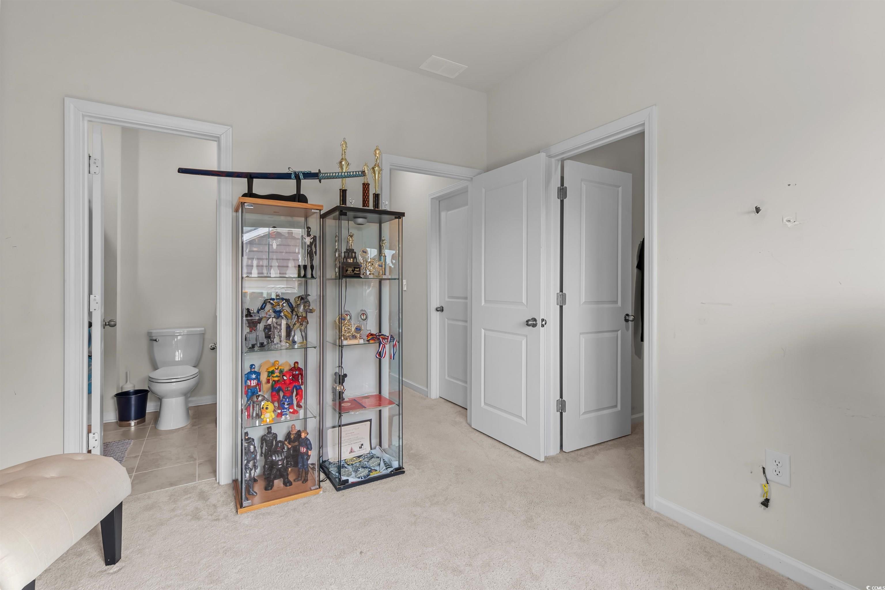 1176 HARBISON Circle Myrtle Beach, SC 29579 - Photo 34 of 40 Interior space with light carpet, connected bathroom, baseboards, and visible vents
