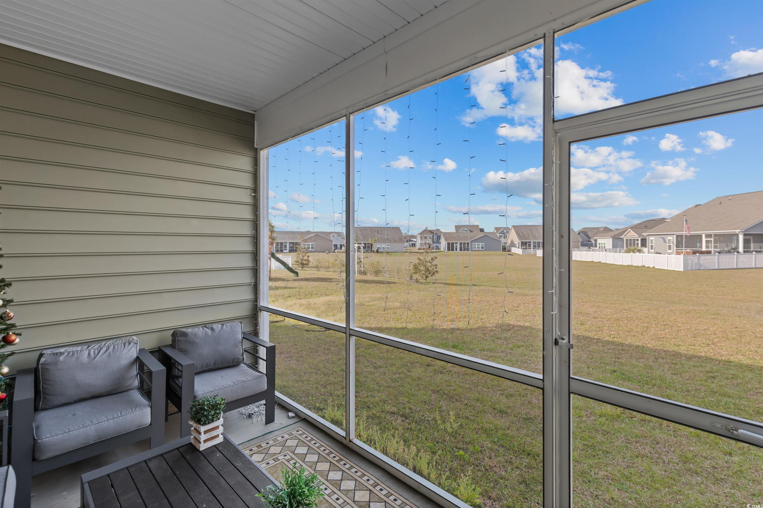 1176 HARBISON Circle Myrtle Beach, SC 29579 - Photo 37 of 40 Unfurnished sunroom with a residential view