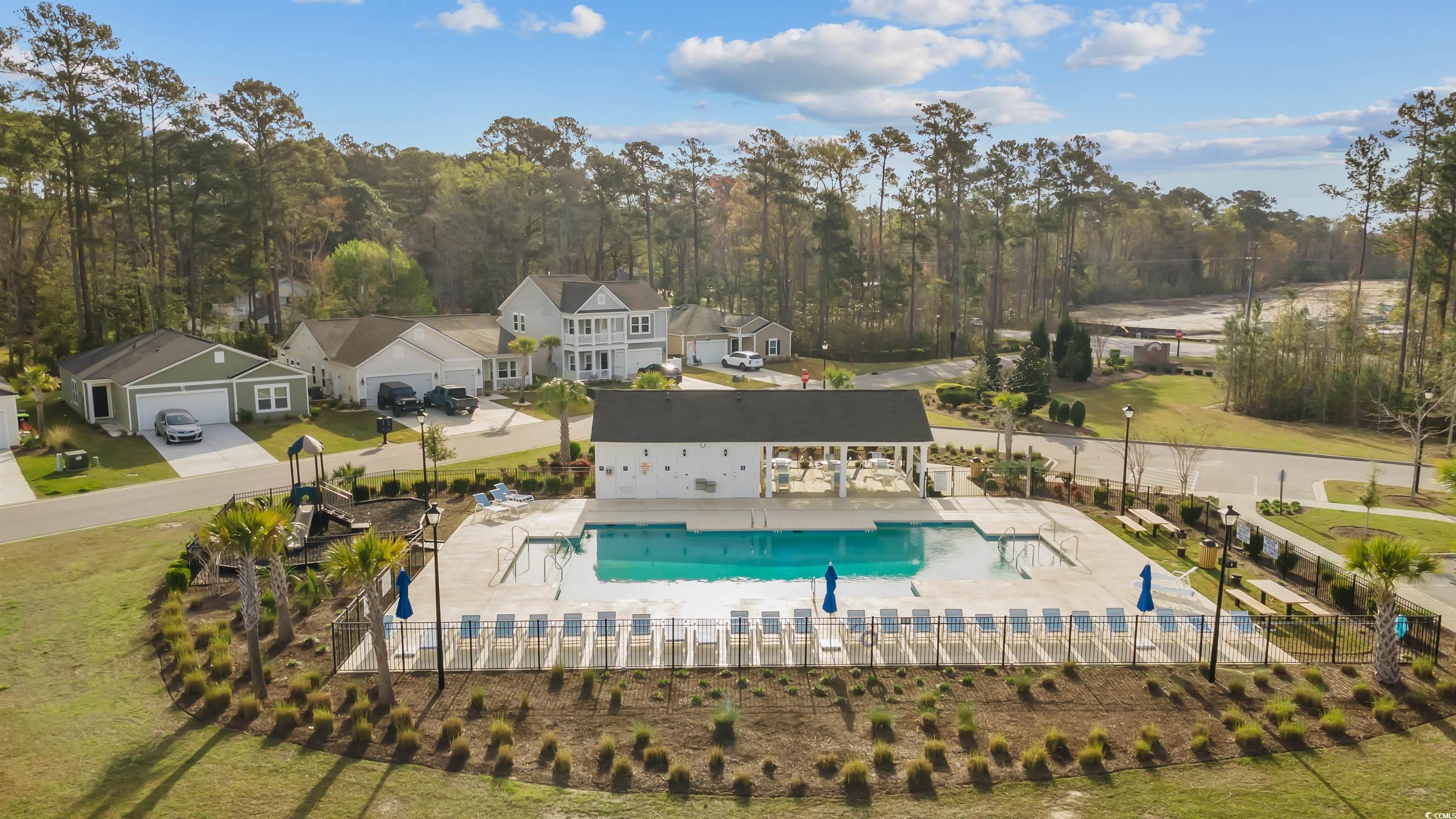 1176 HARBISON Circle Myrtle Beach, SC 29579 - Photo 40 of 40 Community pool featuring a patio area and fence