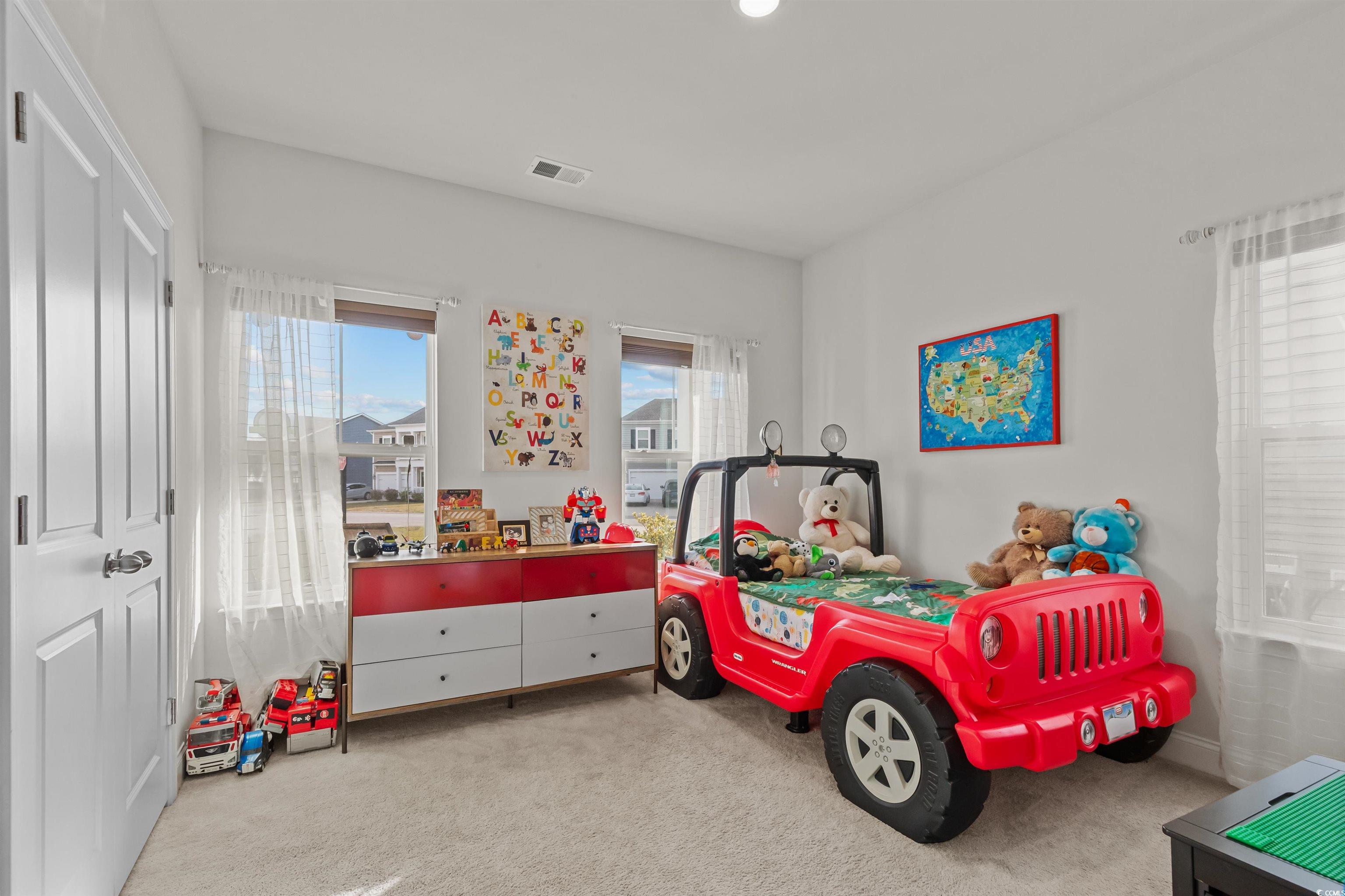 1176 HARBISON Circle Myrtle Beach, SC 29579 - Photo 4 of 40 Carpeted bedroom featuring visible vents