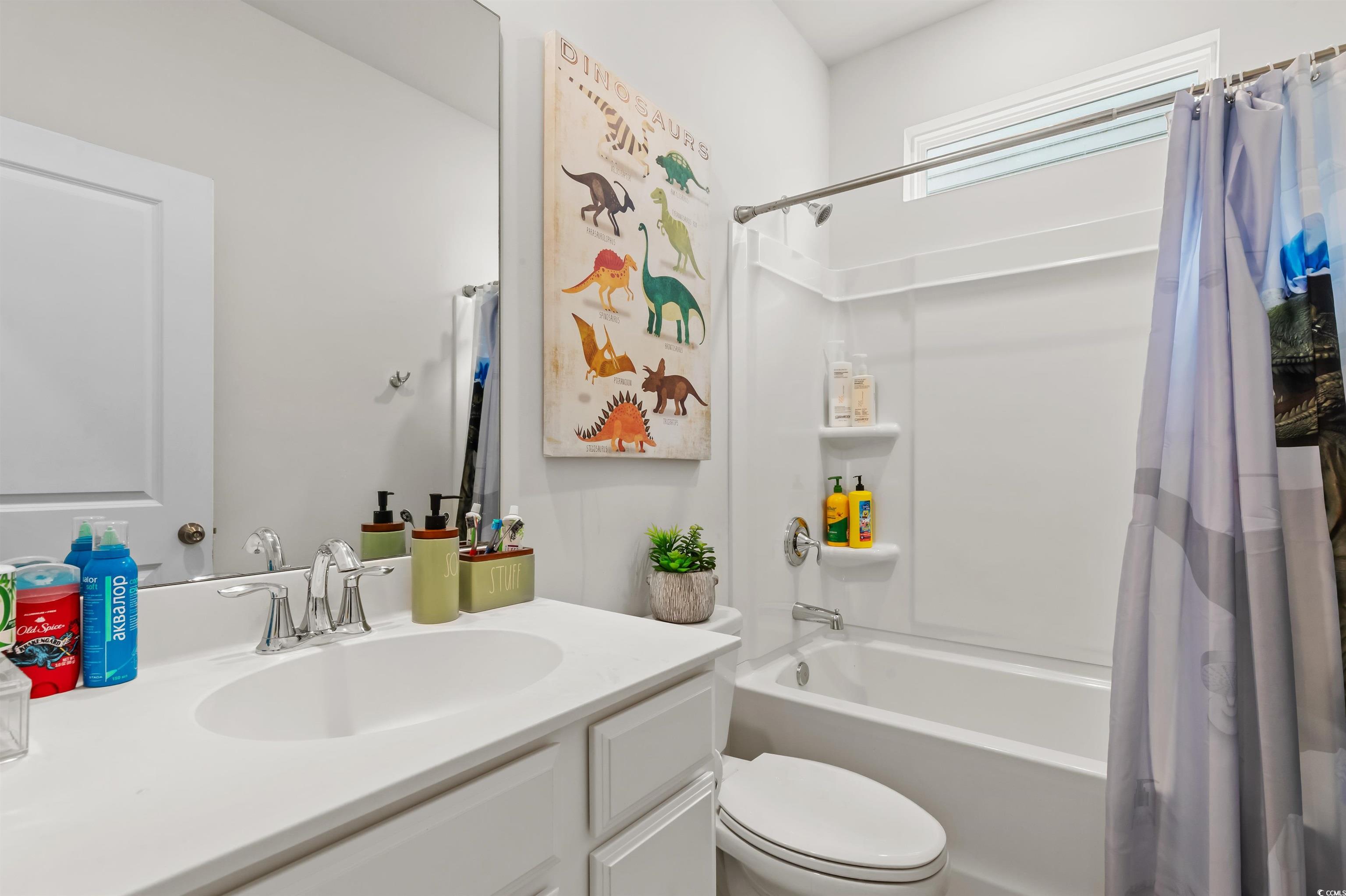 1176 HARBISON Circle Myrtle Beach, SC 29579 - Photo 5 of 40 Bathroom with toilet, vanity, and shower / bathtub combination with curtain