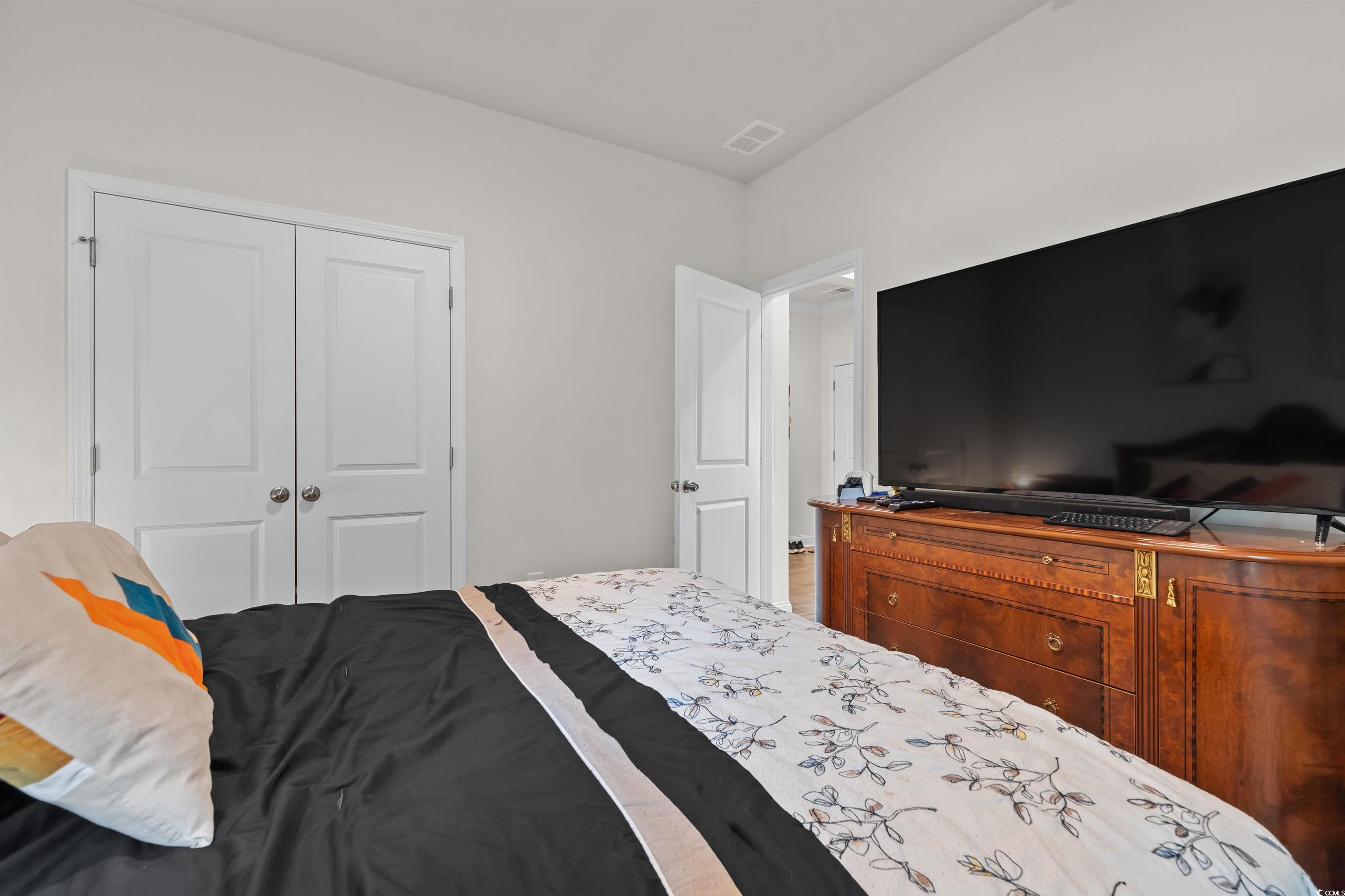 1176 HARBISON Circle Myrtle Beach, SC 29579 - Photo 7 of 40 Bedroom featuring visible vents and a closet