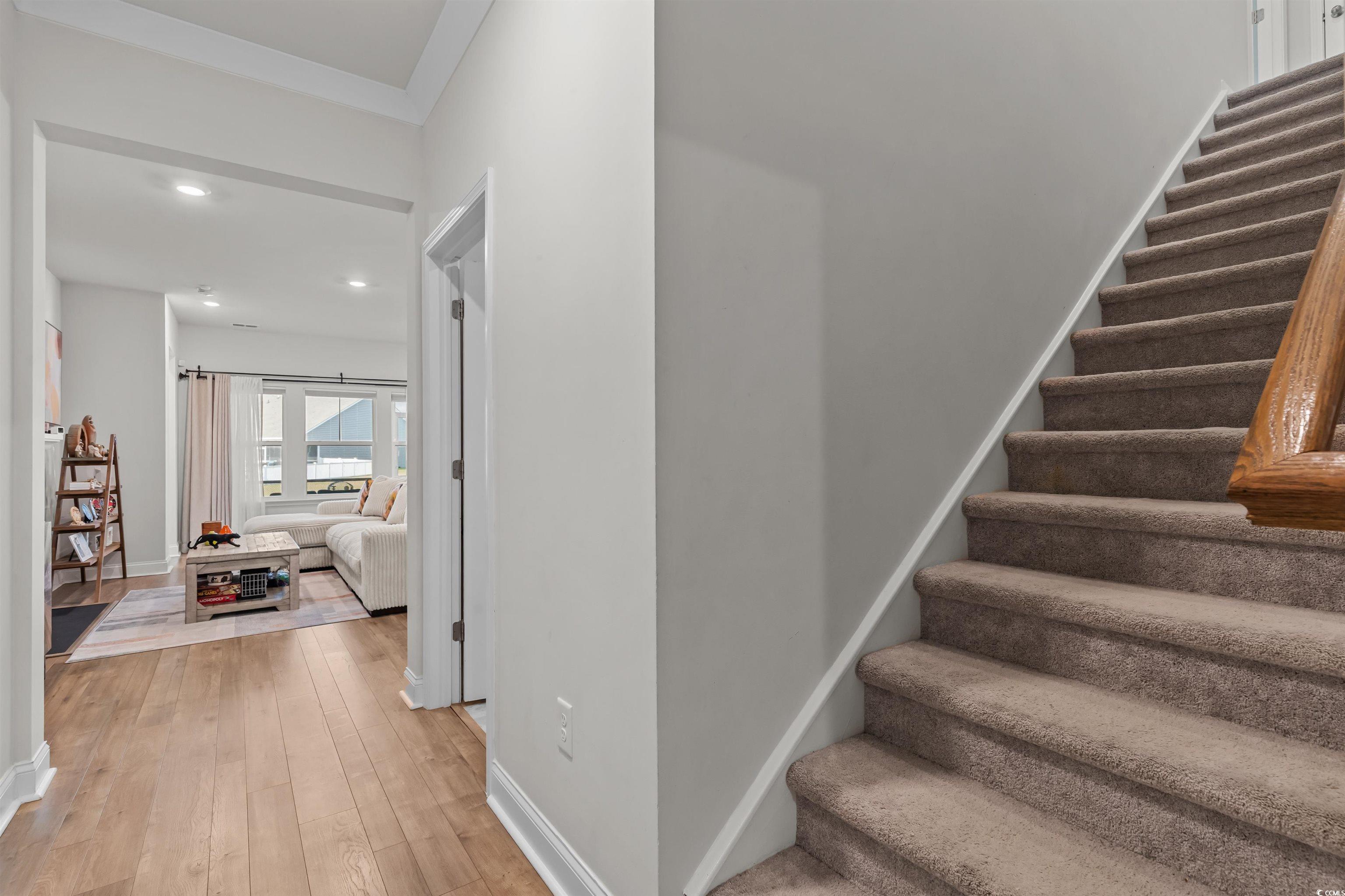 1176 HARBISON Circle Myrtle Beach, SC 29579 - Photo 8 of 40 Staircase featuring baseboards, recessed lighting, and wood-type flooring
