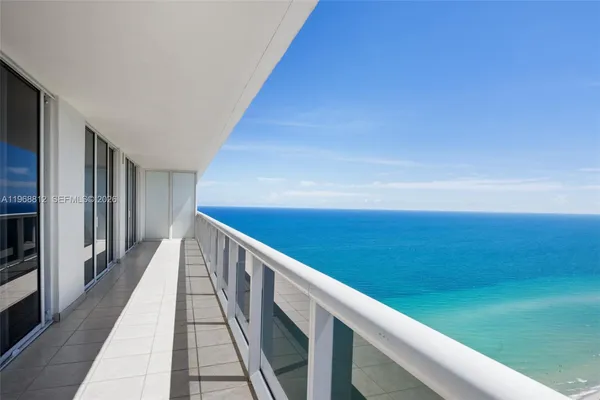 a view of balcony with furniture