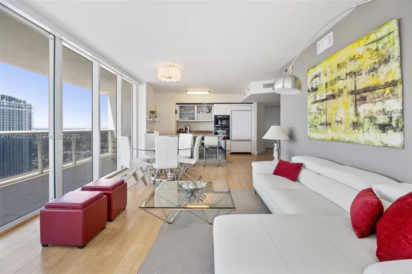 a living room with furniture and a large window
