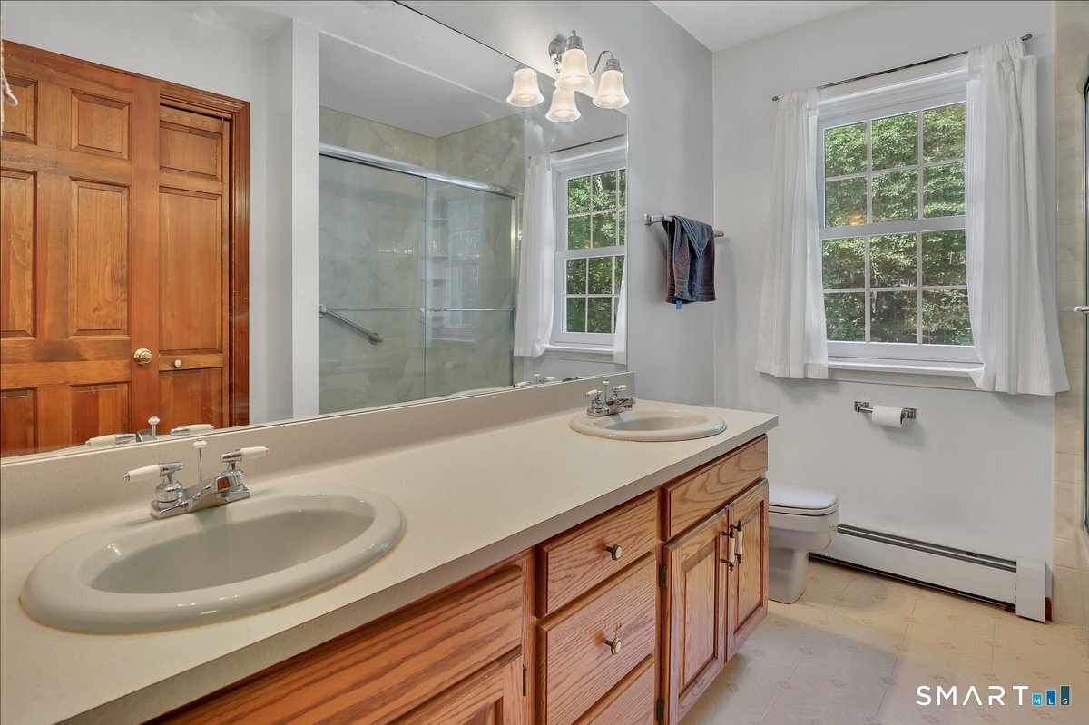 78 Mountain Ridge Drive Coventry, CT 06238 - Photo 24 of 39 Remodeled main bathroom with double sinks and tub/shower combo.
