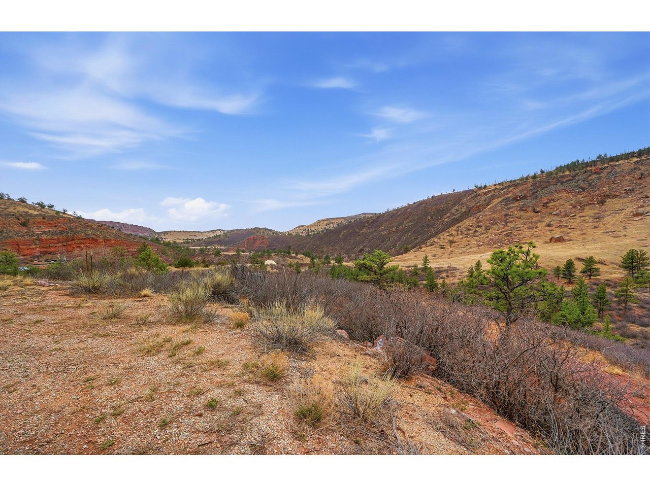 1115 Vision Way Lyons, CO 80540 - Photo 8 of 19 a view of a lake with mountains in the background