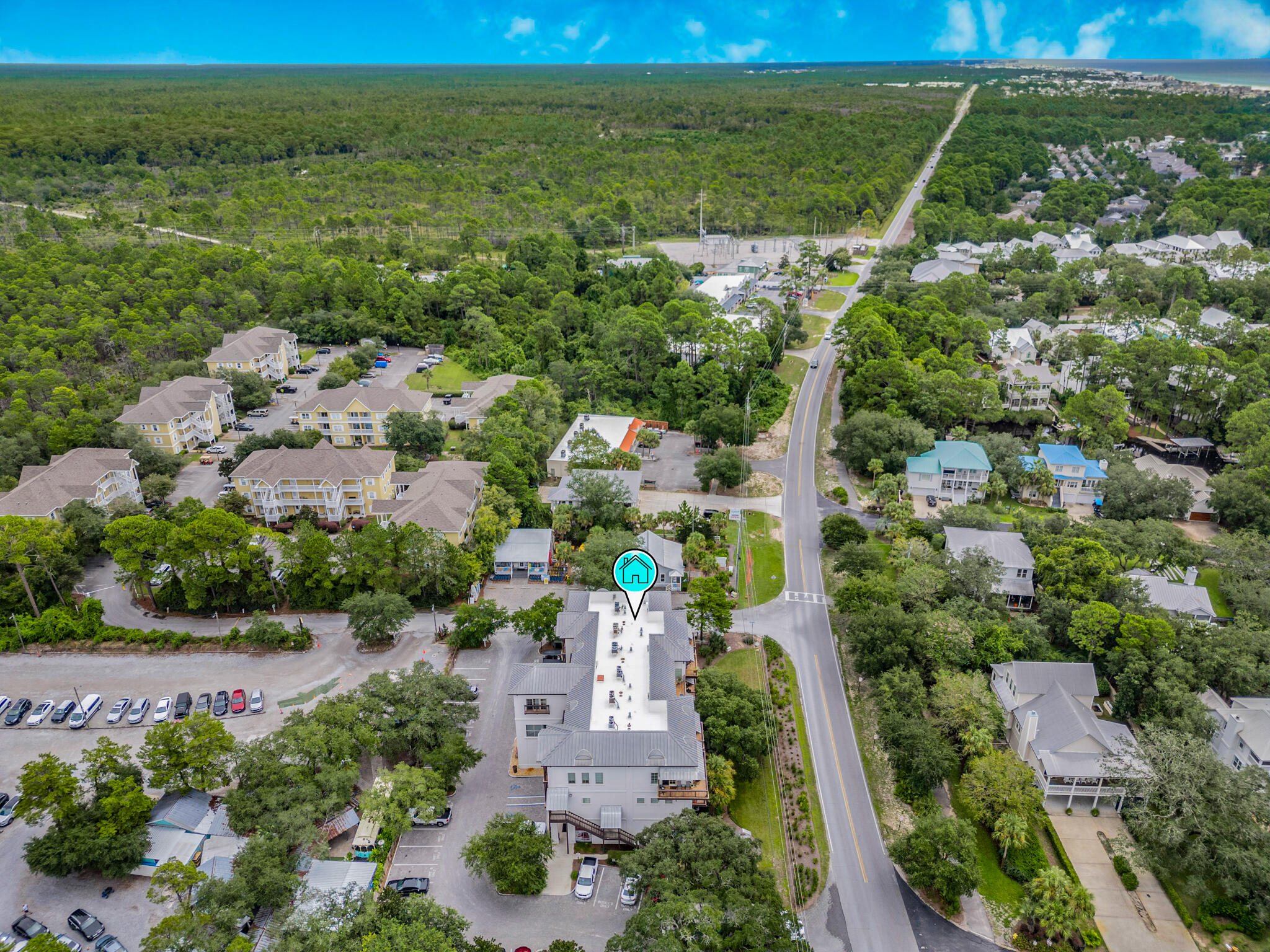 5231 East County Highway 30A, Unit D Santa Rosa Beach, FL 32459 - Photo 32 of 42 an aerial view of residential houses with outdoor space and trees