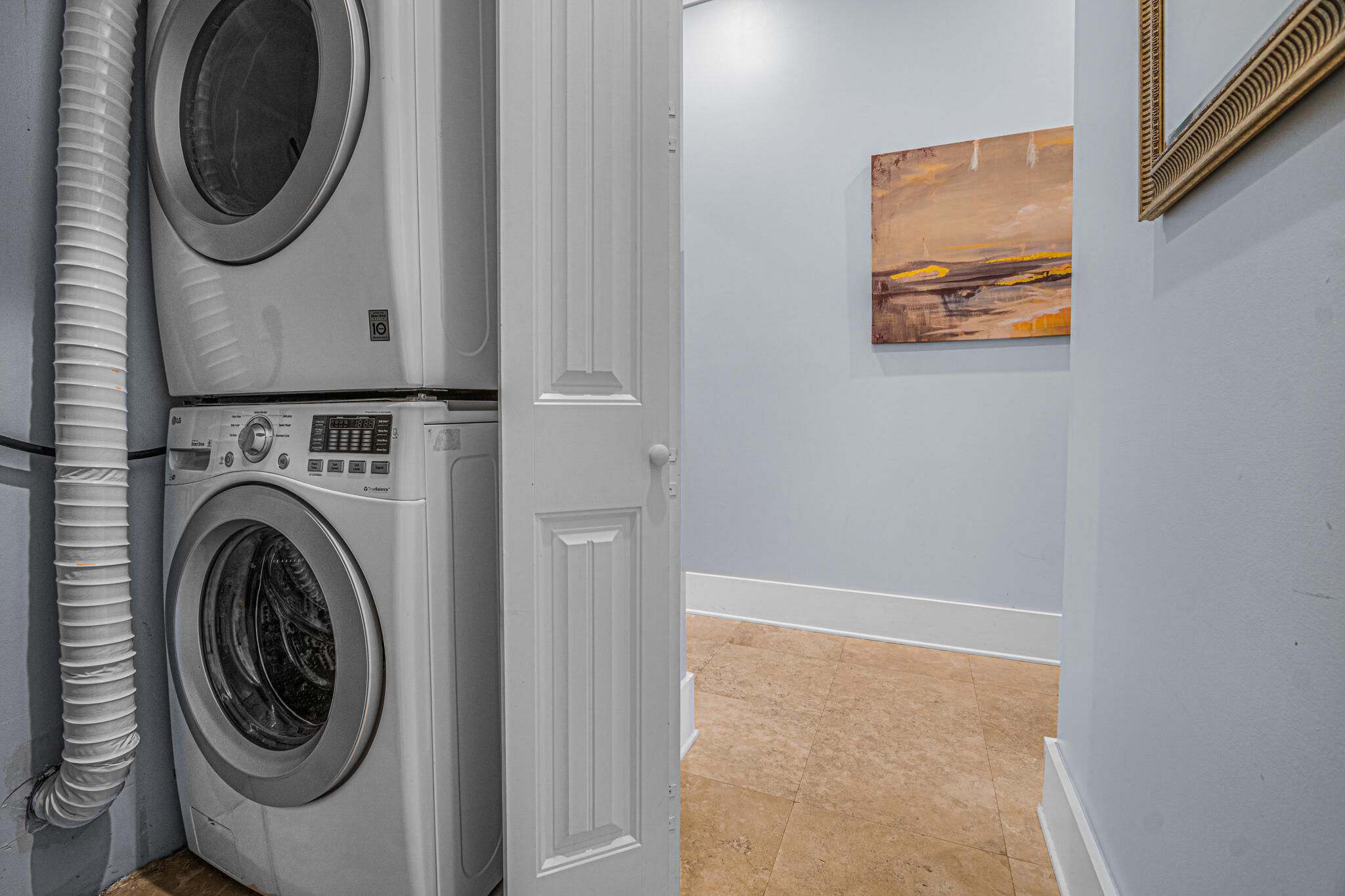 5231 East County Highway 30A, Unit D Santa Rosa Beach, FL 32459 - Photo 8 of 42 a utility room with dryer and washer