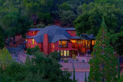 an aerial view of a house with a garden