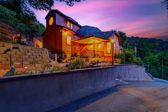 a living room with furniture and a dining table
