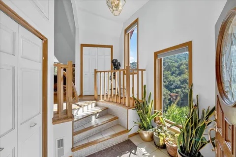a large kitchen with a large window and a sink