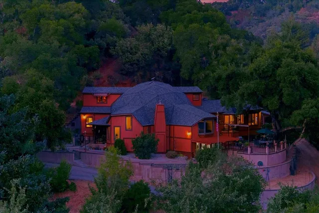 a view of a house with a yard and garden