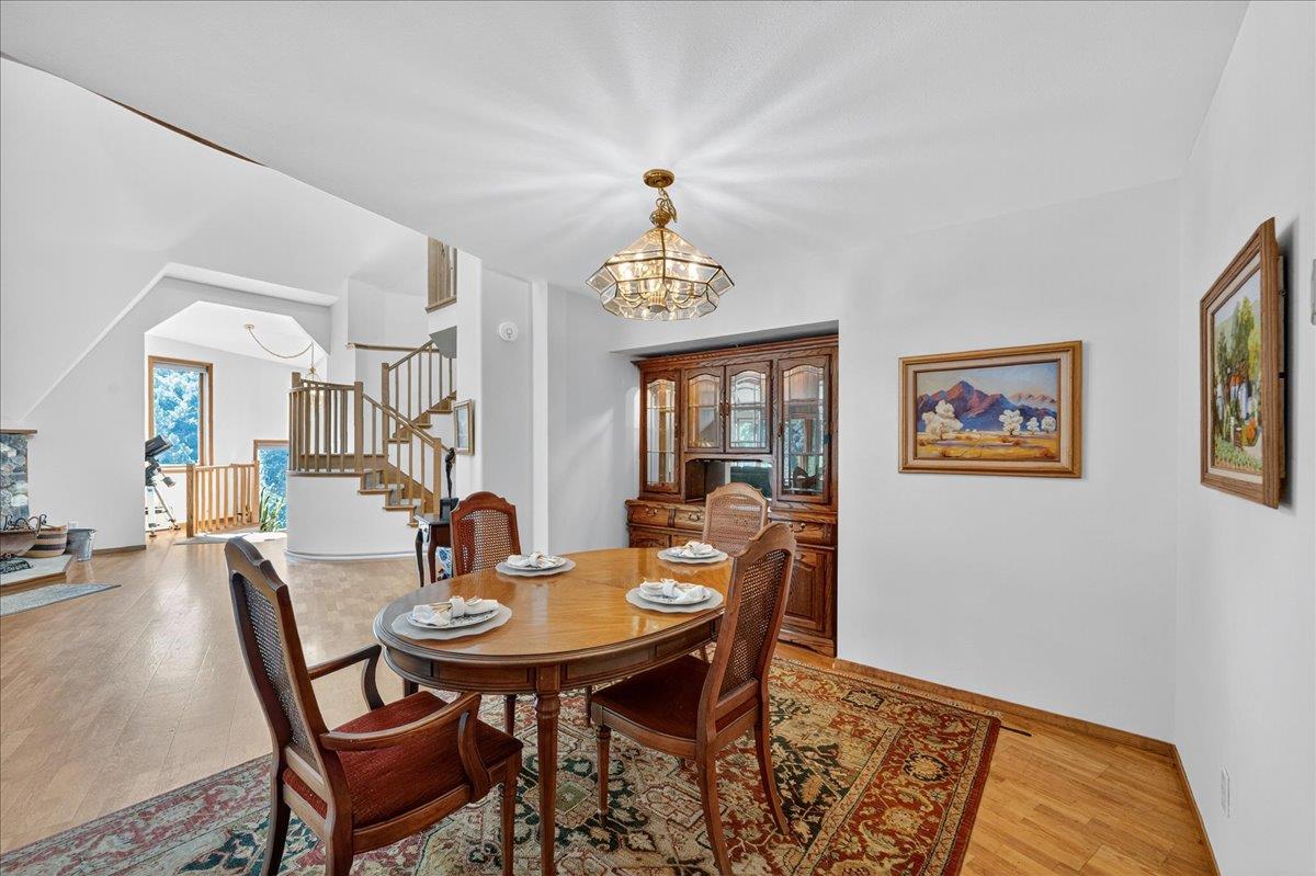 5224 Twin Falls Road Morgan Hill, CA 95037 - Photo 30 of 111 a view of a dining room with furniture window and wooden floor