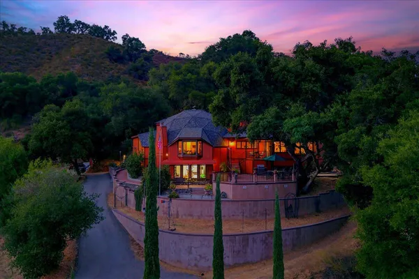 an aerial view of a house with a yard