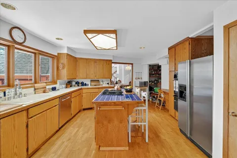 a view of a kitchen with a window and cabinets