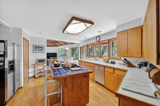 a view of a patio with table and chairs potted plants