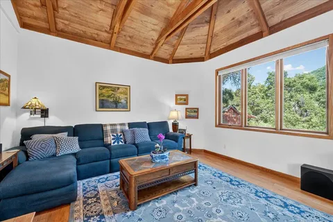 a backyard of a house with barbeque oven table and chairs
