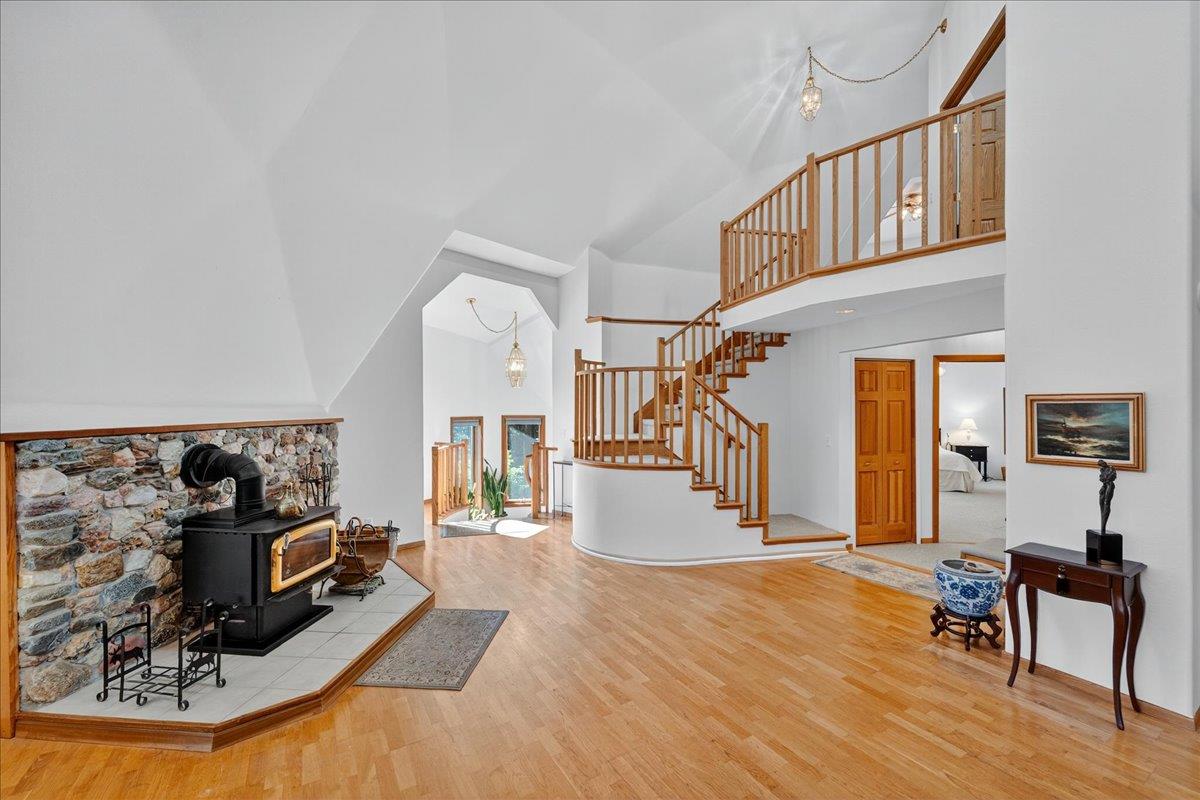 5224 Twin Falls Road Morgan Hill, CA 95037 - Photo 44 of 111 a living room with furniture stove and a wooden floor
