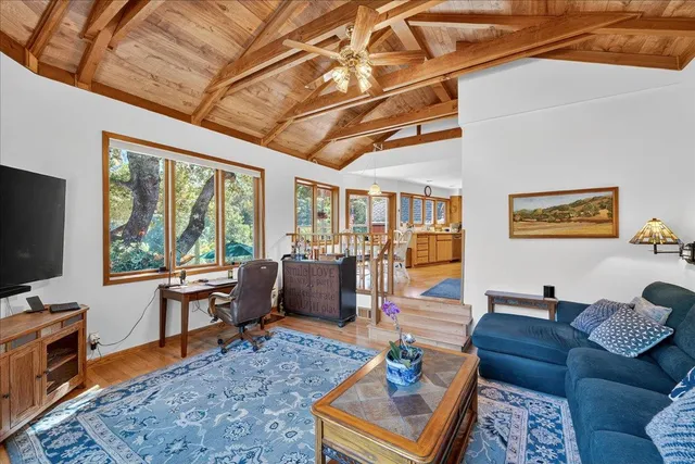 an aerial view of a house with a big yard