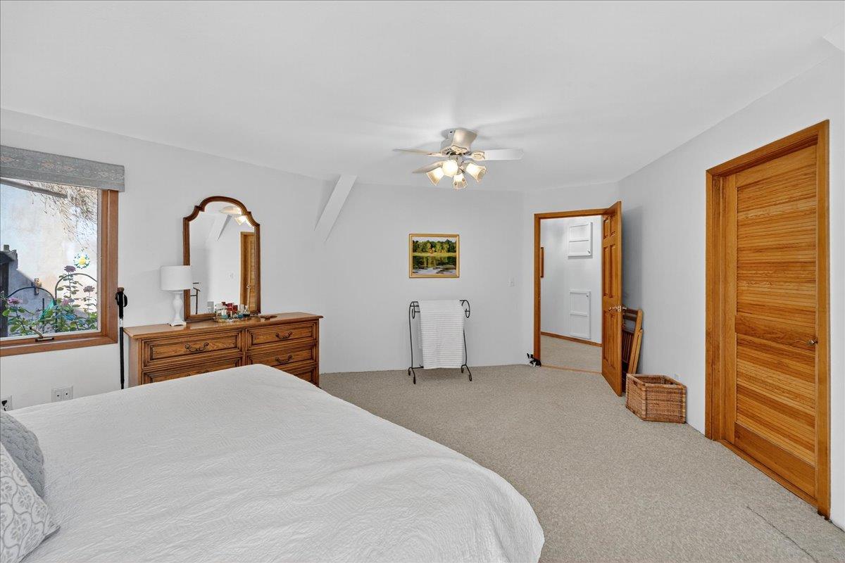 5224 Twin Falls Road Morgan Hill, CA 95037 - Photo 50 of 111 a bedroom with a bed and a chandelier