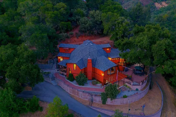 a view of a patio with a table chairs and a backyard