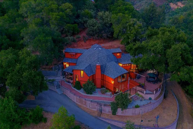 a view of a patio with a table chairs and a backyard
